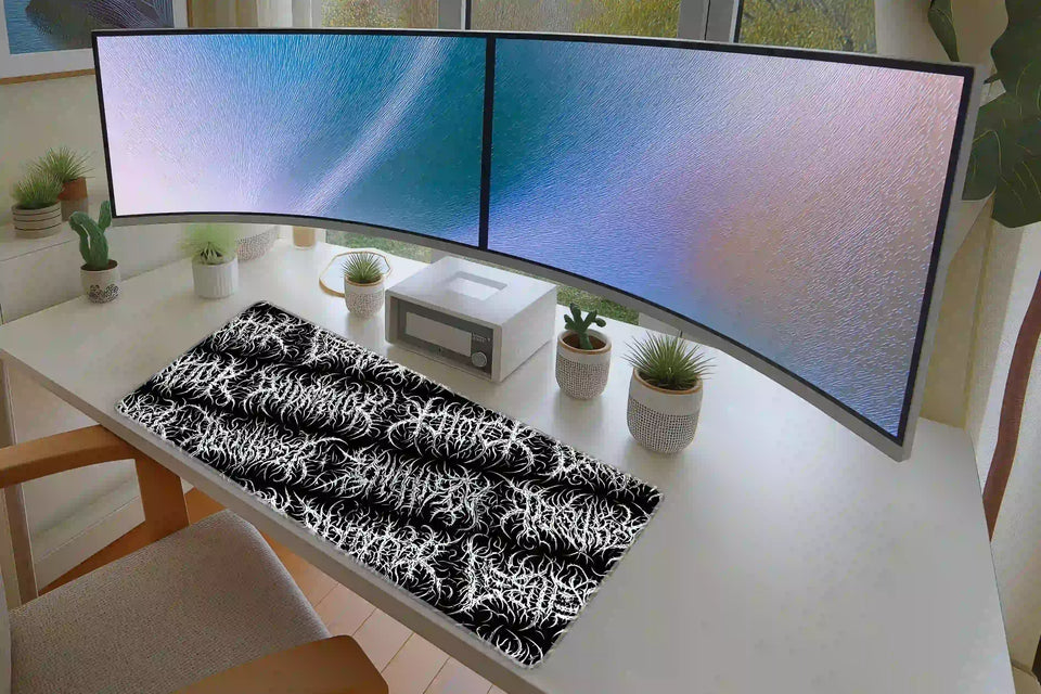 Keyboard and mouse workspace styled with the black metal thorncore gothic pattern desk mat