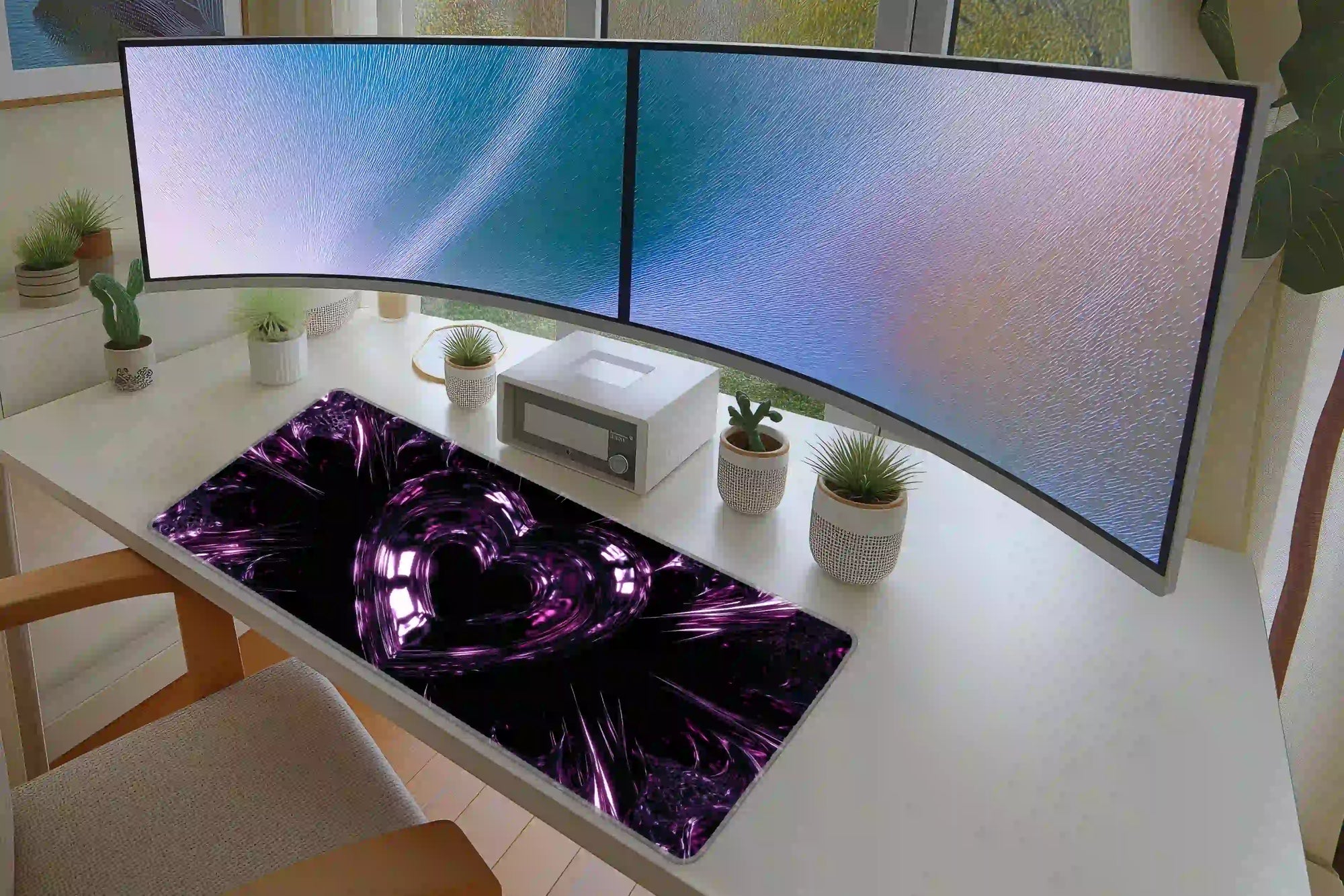 Pink and purple chrome heart Y2K mouse pad in a full student or gaming desk setup