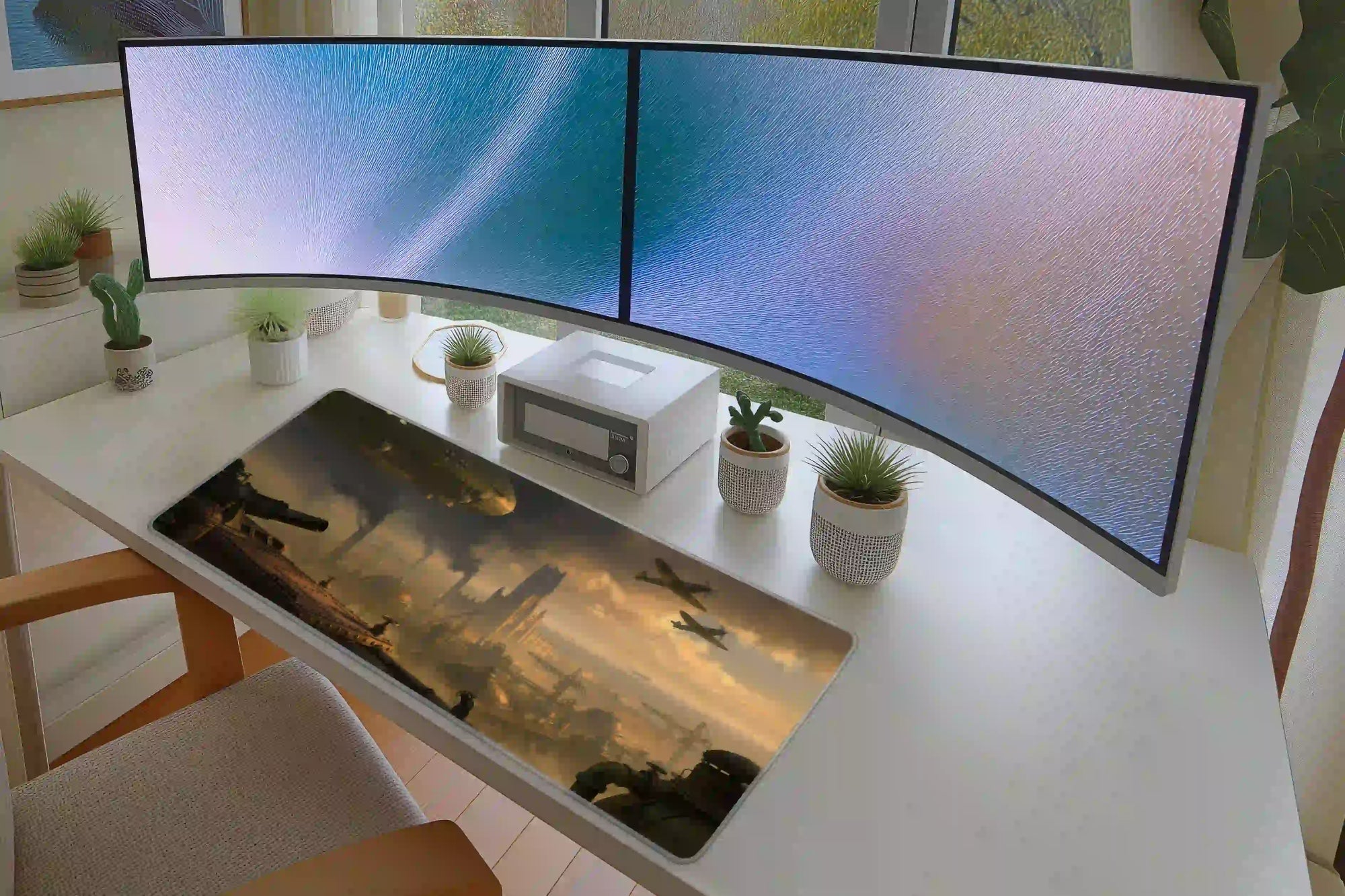 Full desk setup with the dieselpunk airship industrial city mat beneath a keyboard and mouse