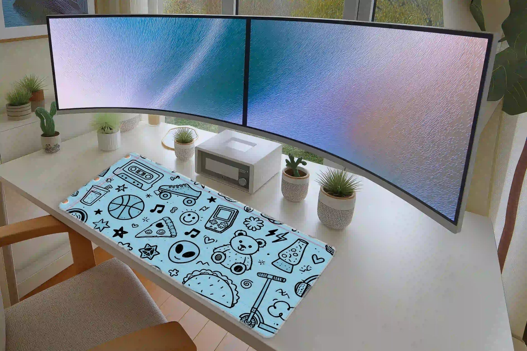 Notebook Doodle desk mat in a full desk setup with a keyboard and mouse layout