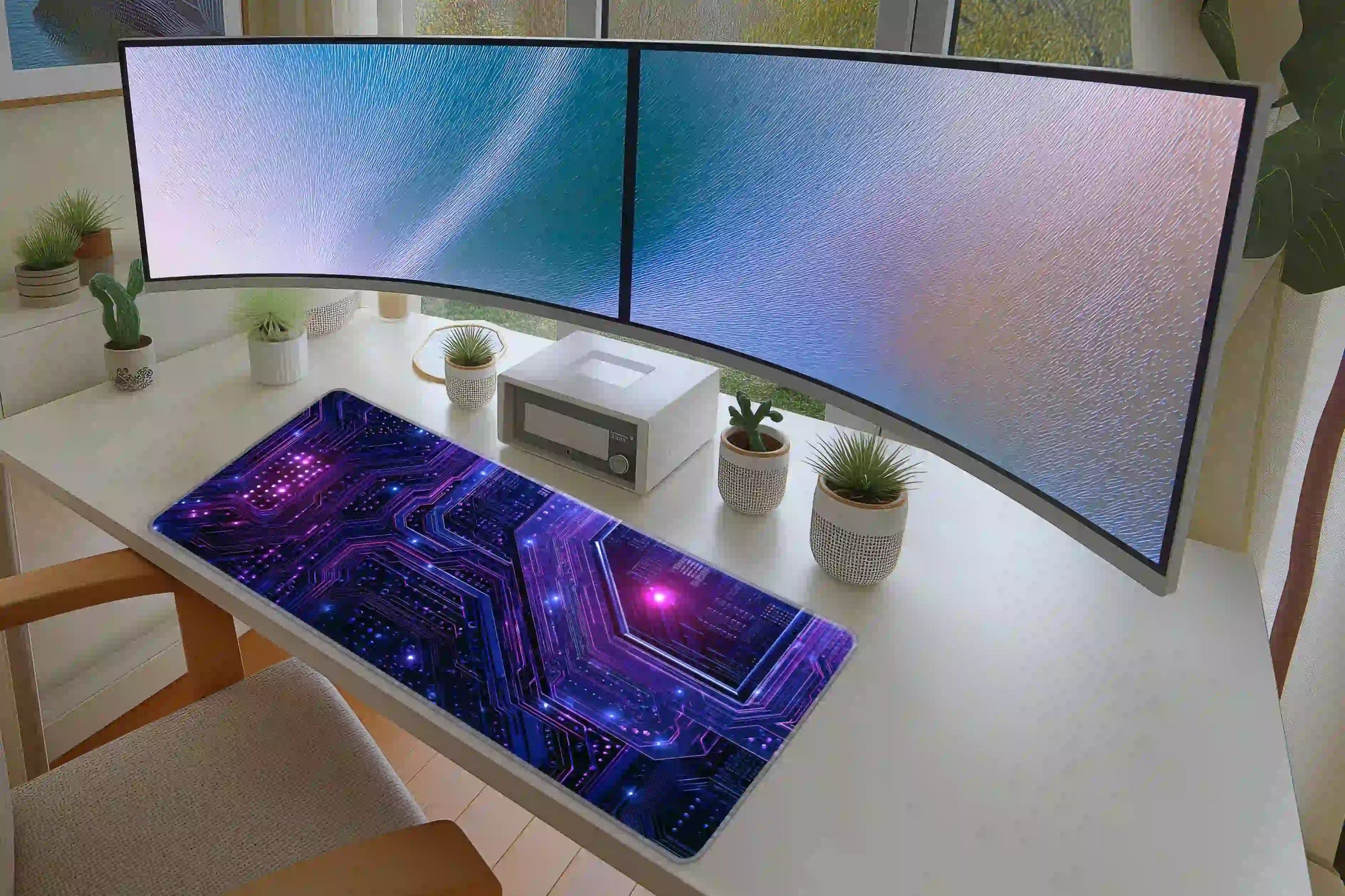 Keyboard and mouse workspace styled with the neon cyber circuit board desk mat