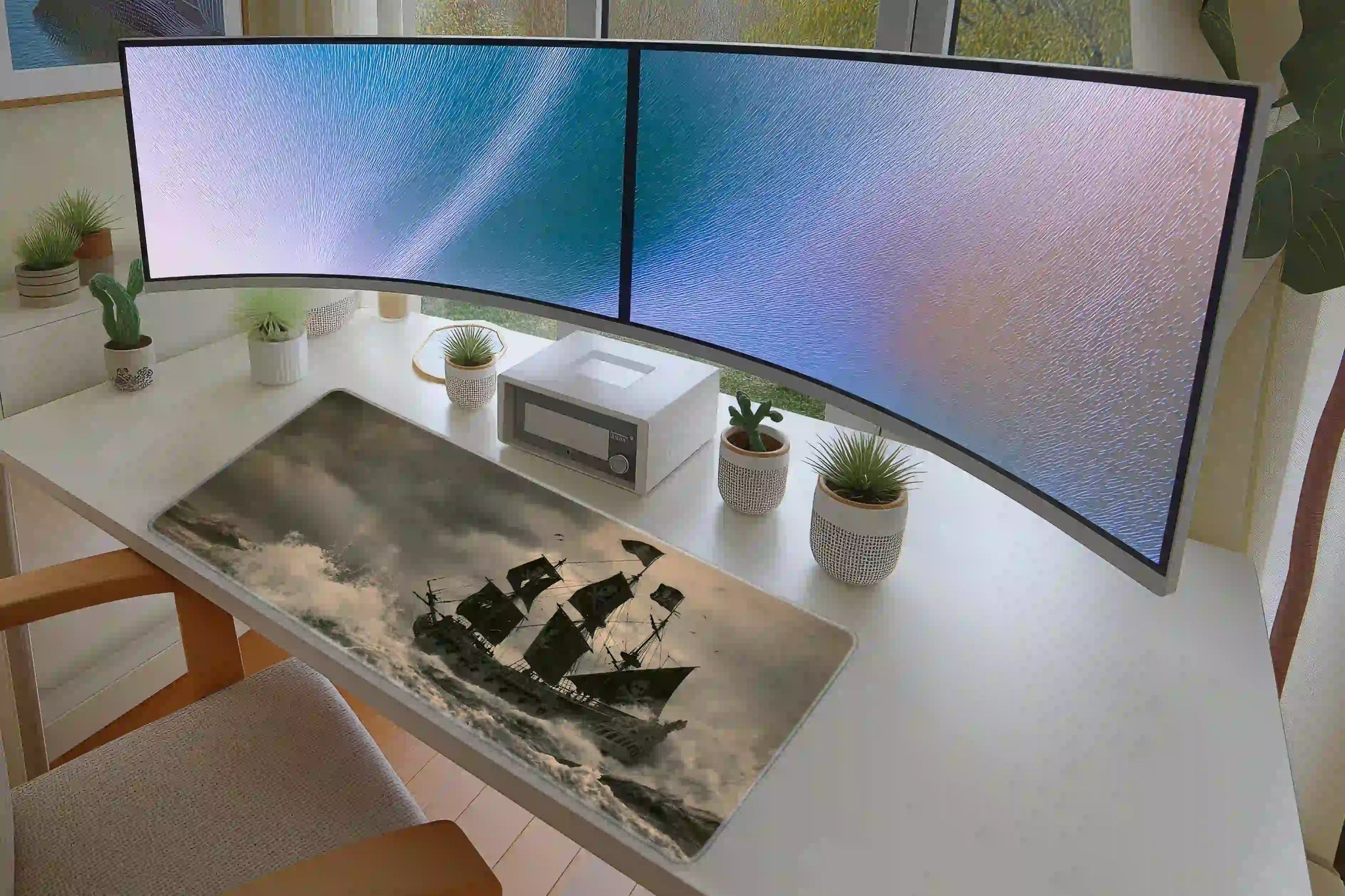 Full keyboard and mouse workspace using the Stormy Pirate Ship desk mat