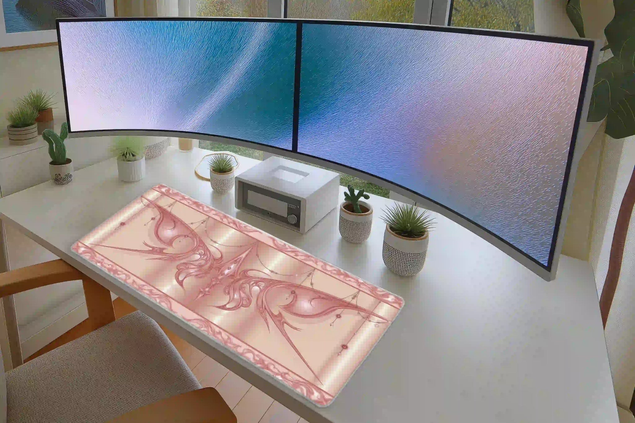 Keyboard and mouse workspace styled with the pastel pink cyber sigil butterfly desk mat