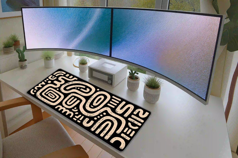 Black and Cream Squiggle desk mat in a full desk setup with a keyboard and mouse layout