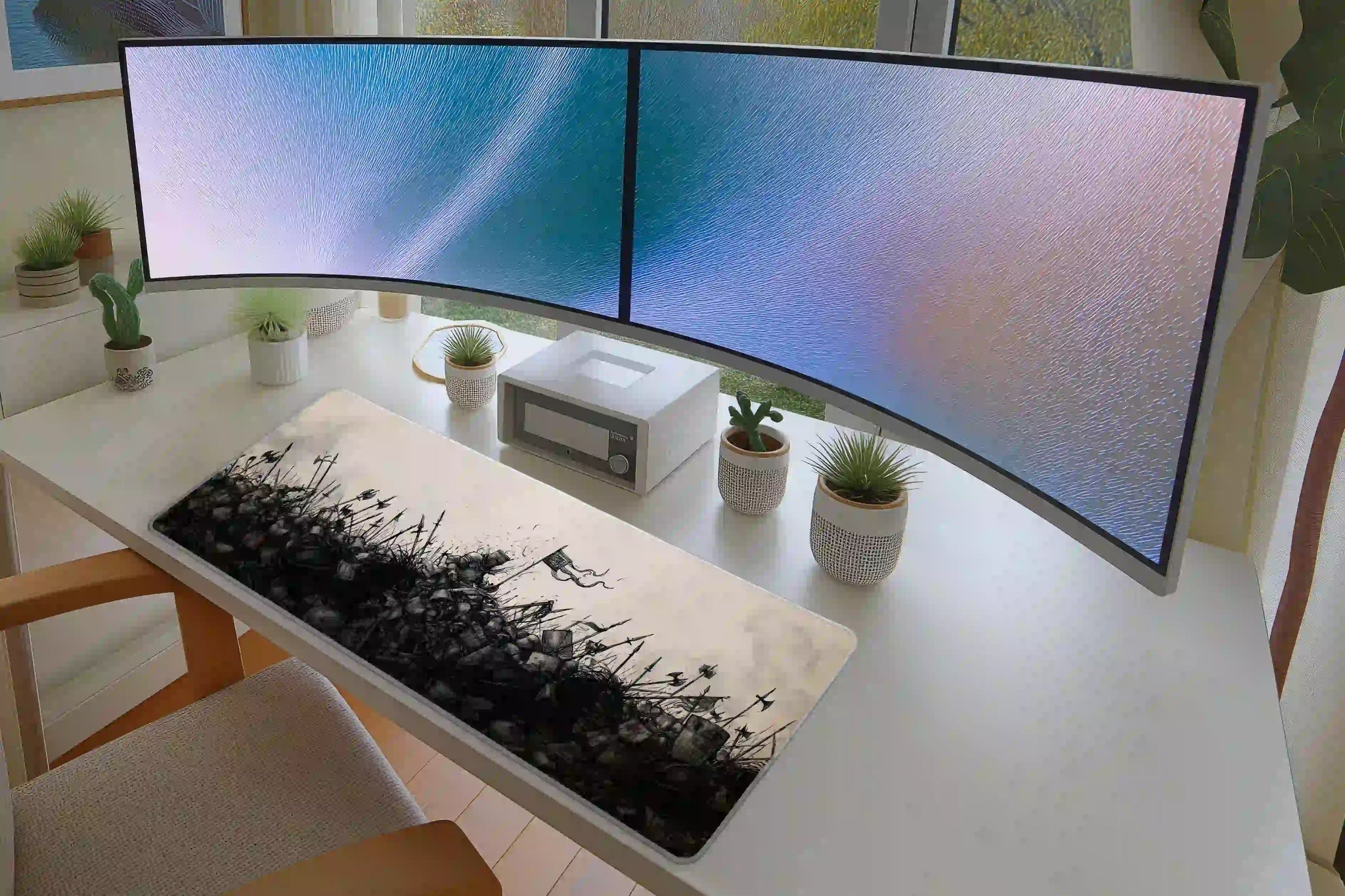 Medieval Battle Sketch desk mat in a full office setup with keyboard and mouse