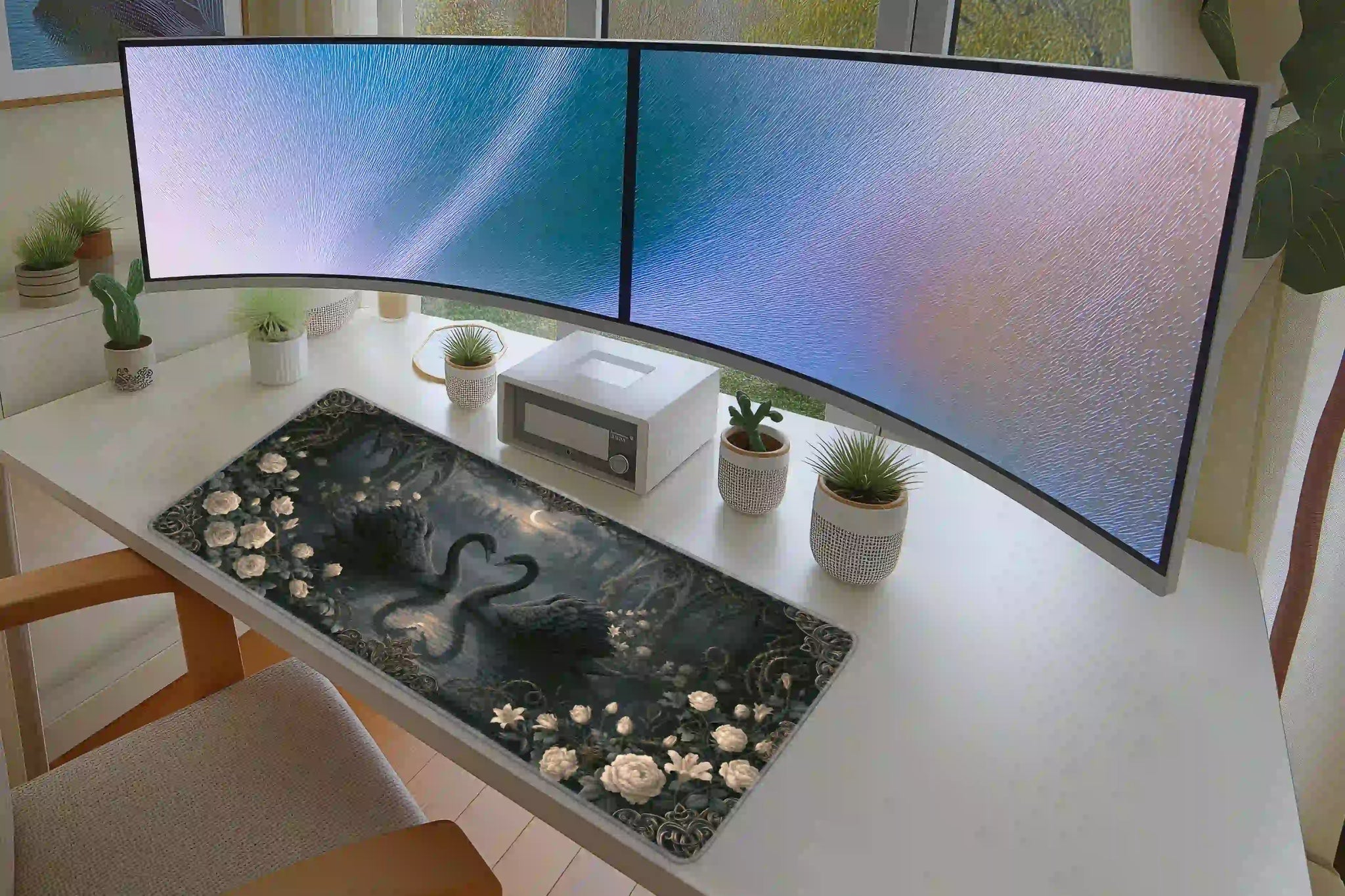 Gothic Swan desk mat in a full desk setup with a keyboard and mouse layout