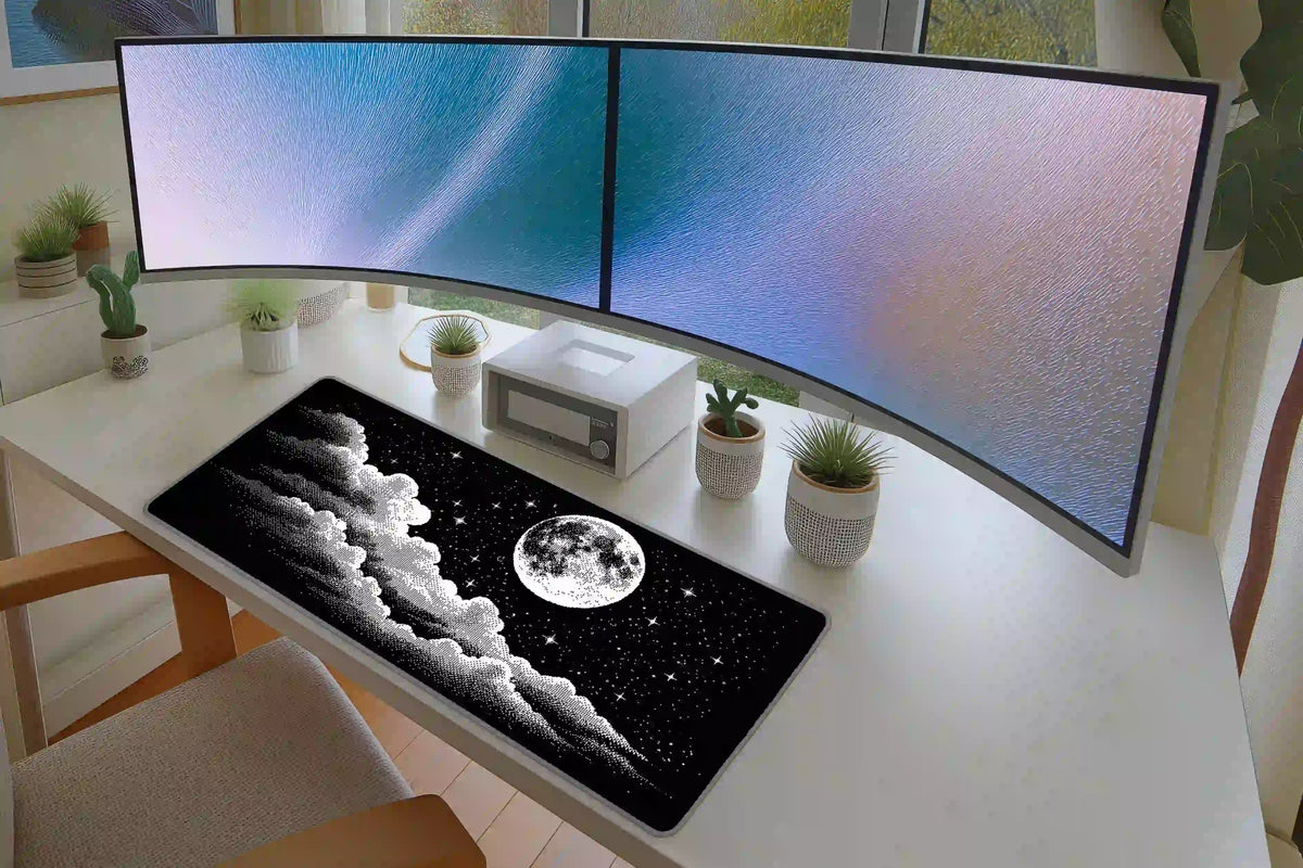 Moonlit cloudscape mat on a white desk beneath curved monitors, with halftone clouds and a full moon across the surface