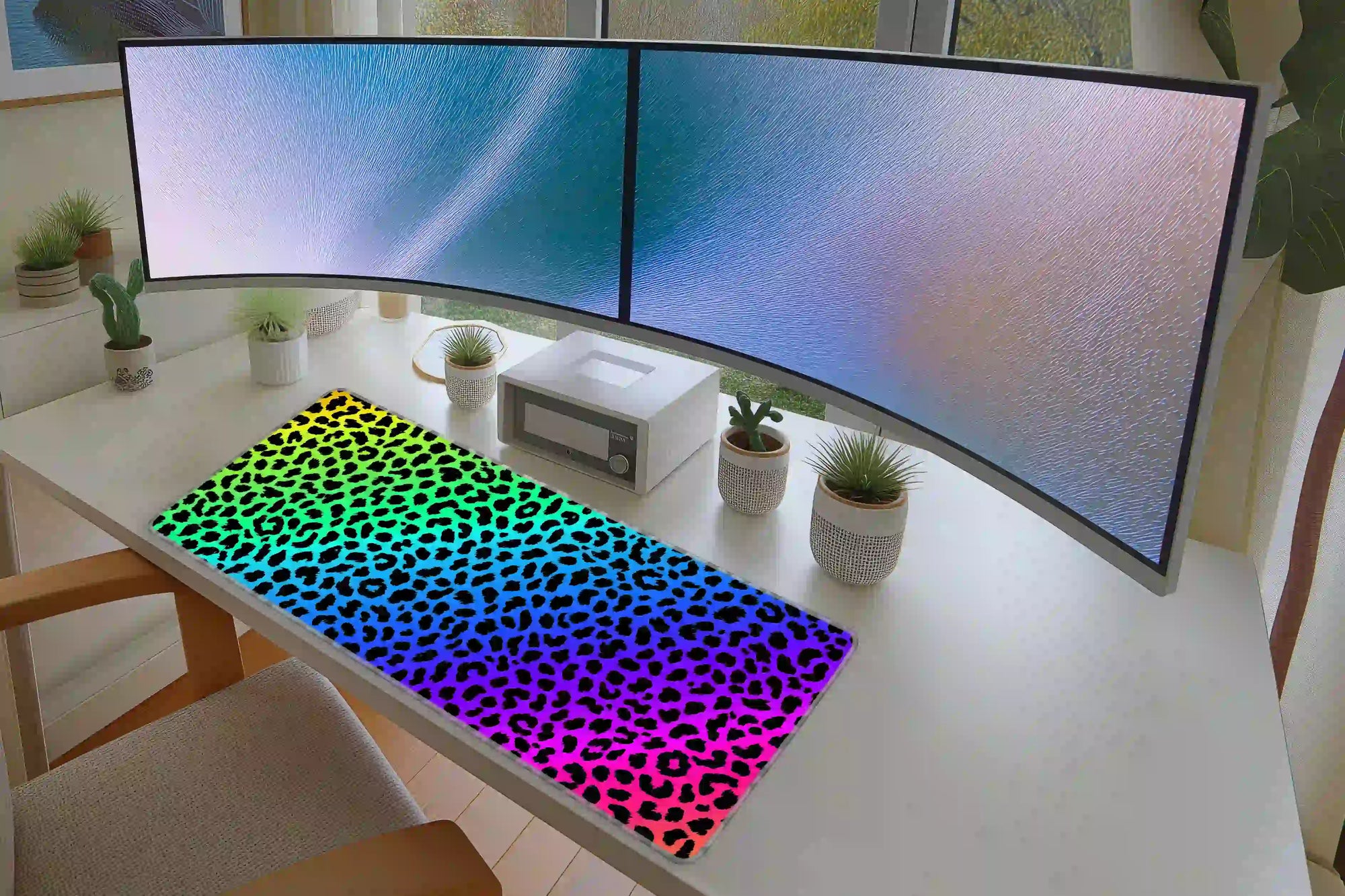 Rainbow Leopard desk mat arranged under a keyboard and mouse on a student study desk
