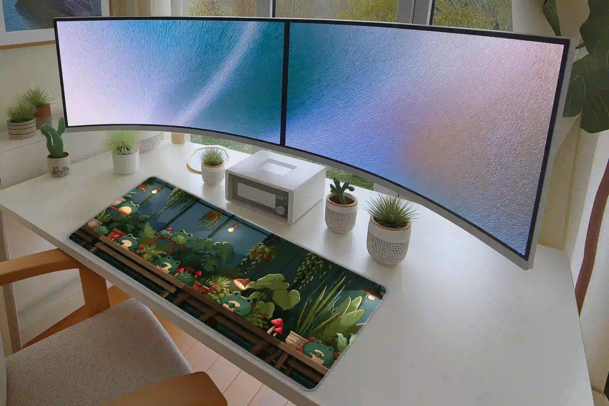 Full desk setup with the cozy frog greenhouse plants mat beneath a keyboard and mouse