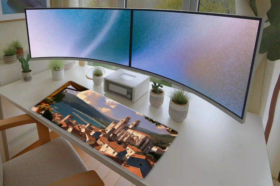 Keyboard and mouse layout on the Mediterranean Village desk mat for a gaming setup
