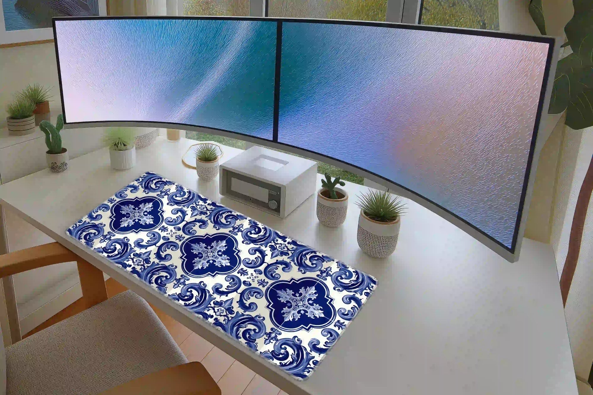 Full keyboard and mouse workspace using the Blue Portuguese Tile desk mat