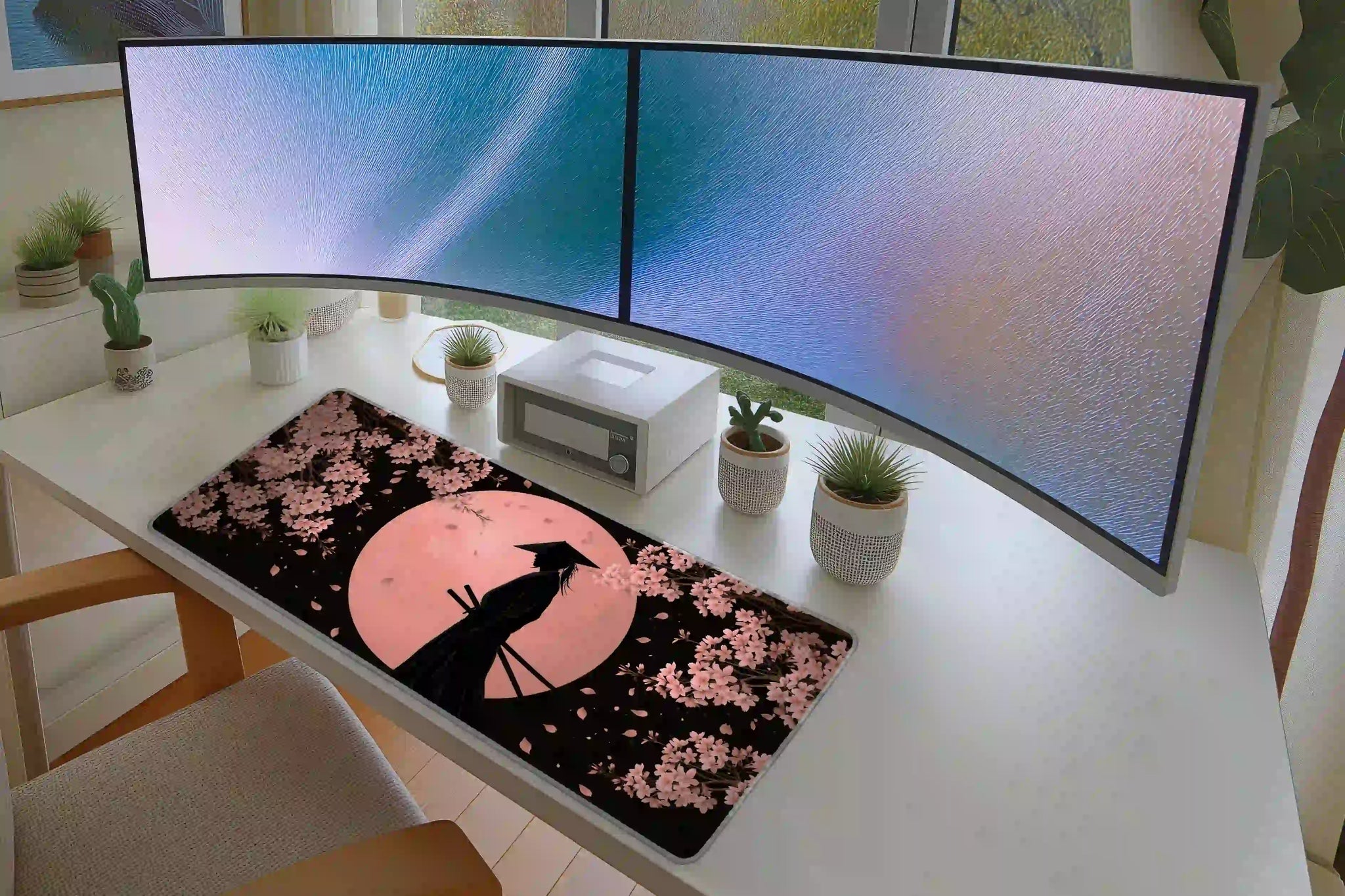 Cherry Blossom Samurai desk mat arranged under a keyboard and mouse on a student study desk