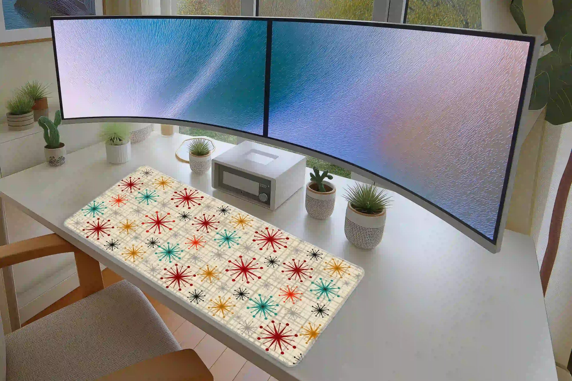 Mid Century Atomic Starburst desk mat in a full office setup with keyboard and mouse