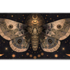 Celestial desk mat with a large sepia moth, golden crescent moons and starbursts against a black background