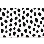 Overhead Dalmatian Spots desk mat view with irregular black animal spots on a crisp white field