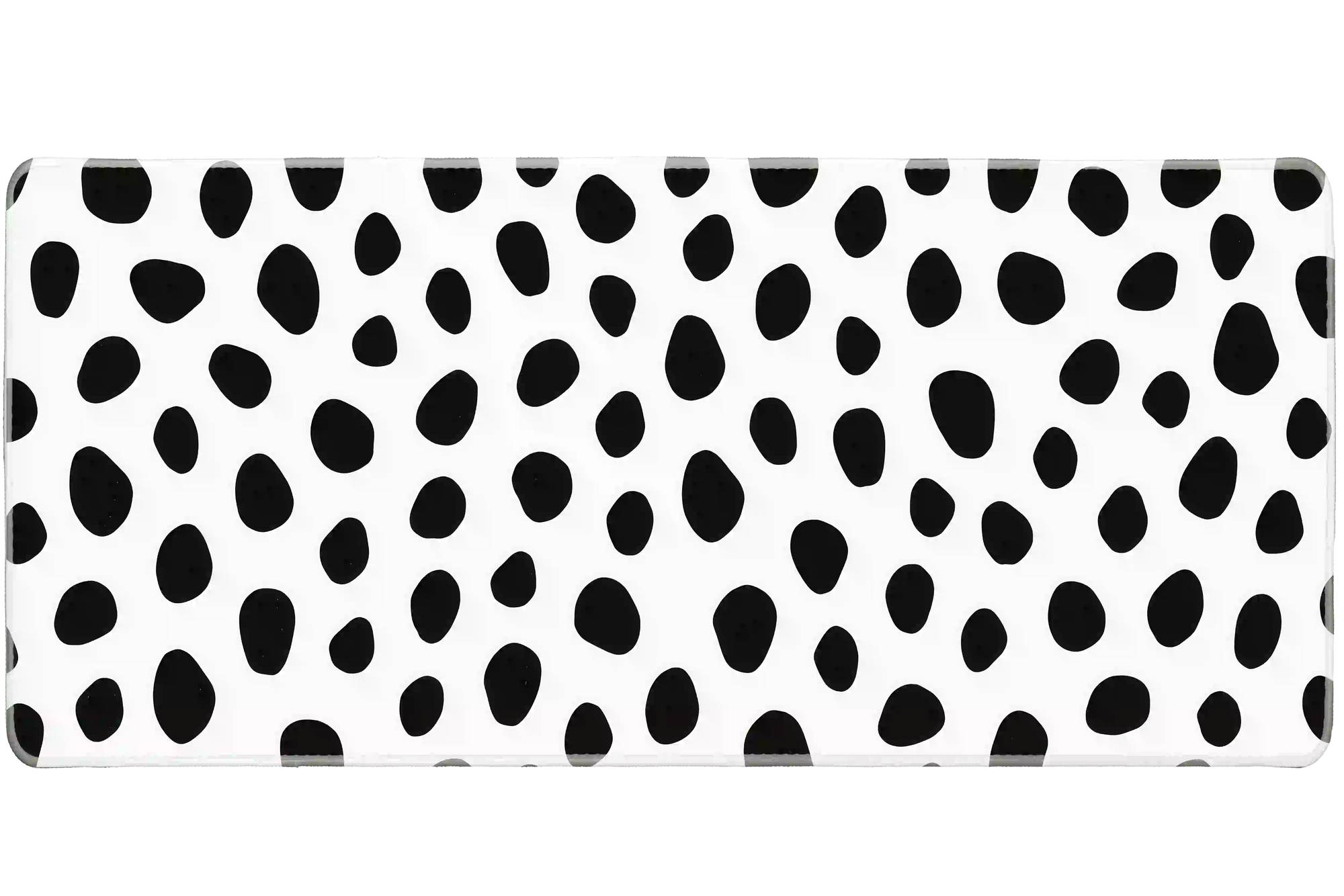 Overhead Dalmatian Spots desk mat view with irregular black animal spots on a crisp white field