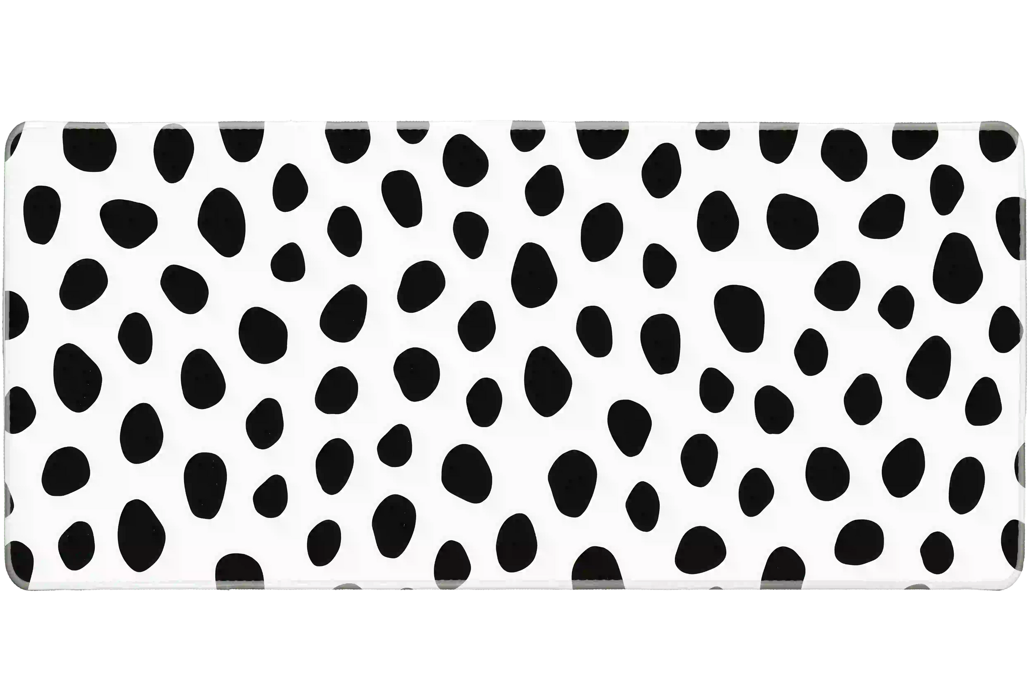 Overhead Dalmatian Spots desk mat view with irregular black animal spots on a crisp white field