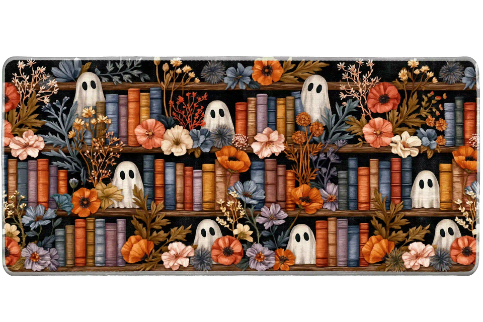 Cozy ghost floral Halloween library artwork on an extended desk mat for a full keyboard and mouse layout