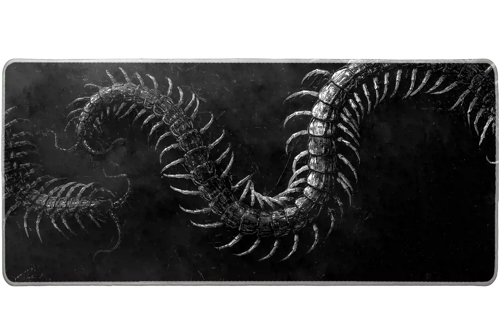 Gothic Centipede desk mat product view highlighting engraved white centipedes twisting across distressed black