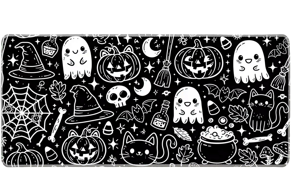 Black and white Halloween doodle desk mat with smiling ghosts, cats, pumpkins, bats, witch hats and potion bottles