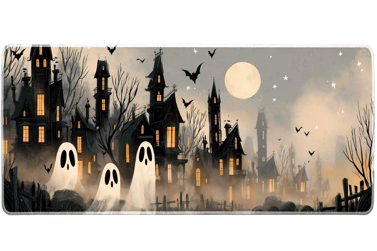 Haunted village desk mat with cream ghosts, black houses, glowing orange windows and a full moon in gray fog
