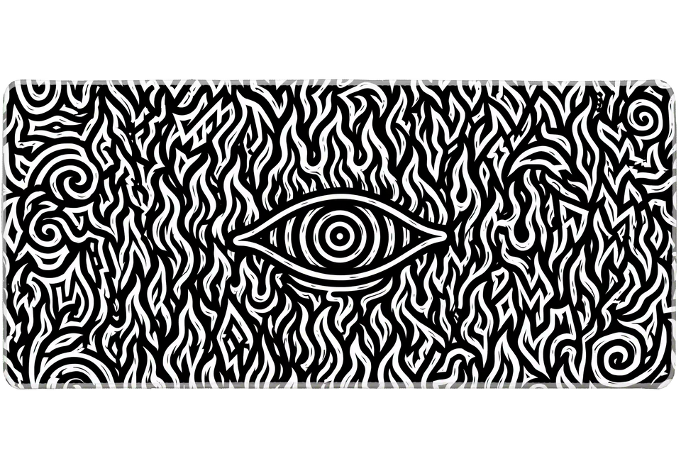 Black and white hypnotic eye desk mat with a central eye surrounded by swirling flame shapes and spirals
