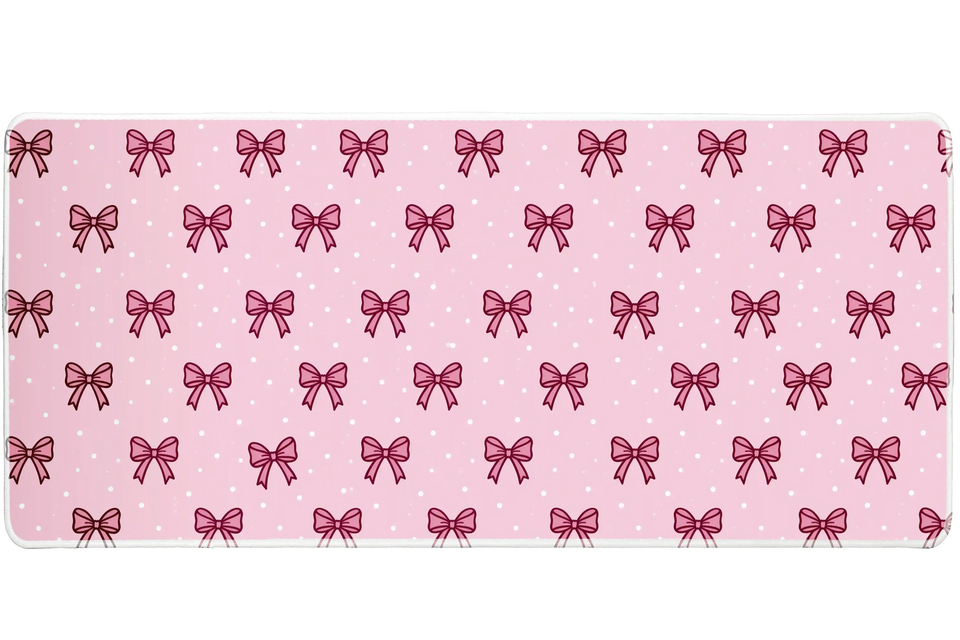 Pink Mini Bow Polka Dot Coquette desk mat with small ribbon outlines and tiny white polka dots