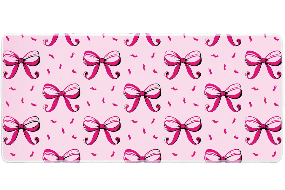 Cute Pink Bow Pattern Pastel Coquette desk mat with repeating coquette bow illustrations on a blush