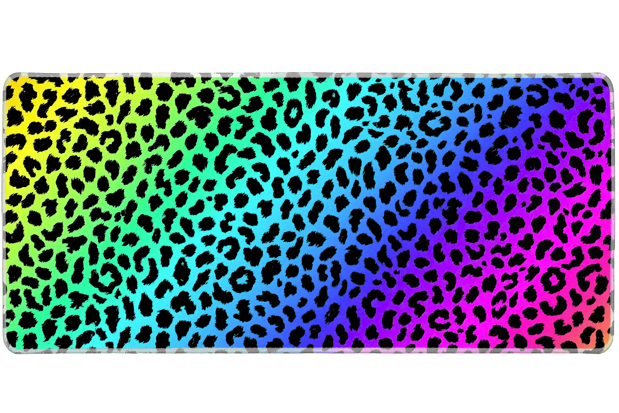 Full-width Rainbow Leopard desk mat showing black leopard spots over a vivid rainbow gradient