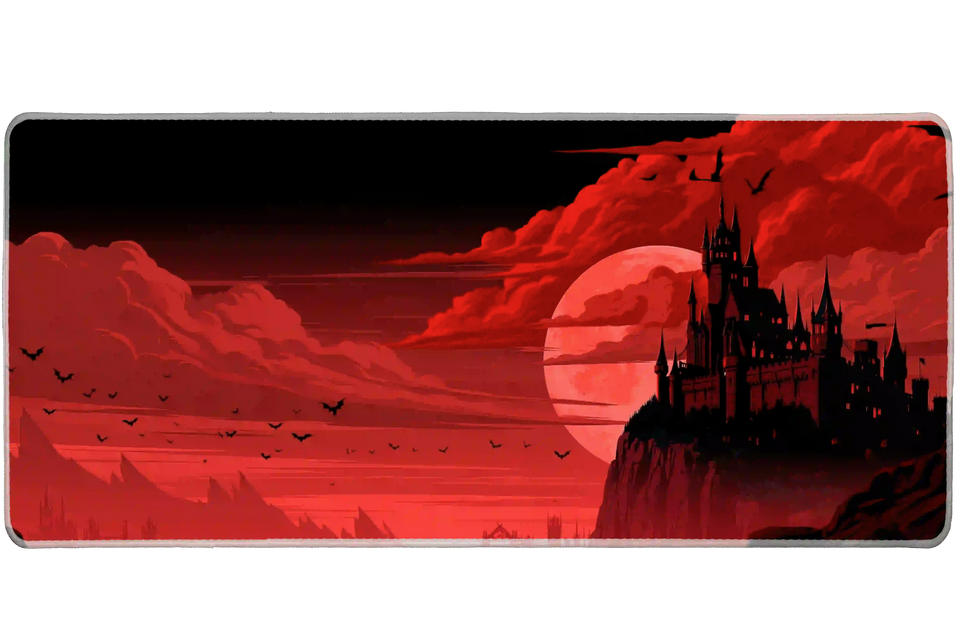 Red moon gothic castle desk mat with a black fortress, flying bats and sweeping crimson clouds