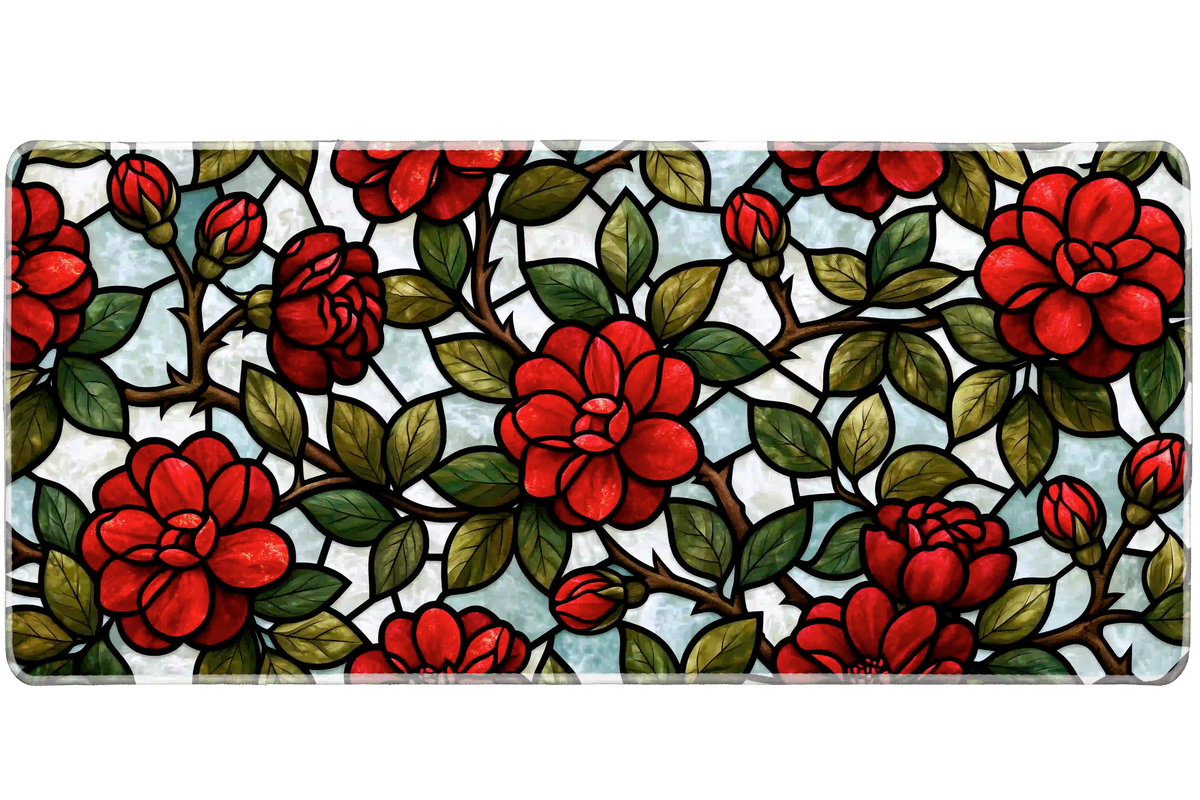Red rose stained glass style desk mat with green leaves, brown vines and black outlines over pale blue and white