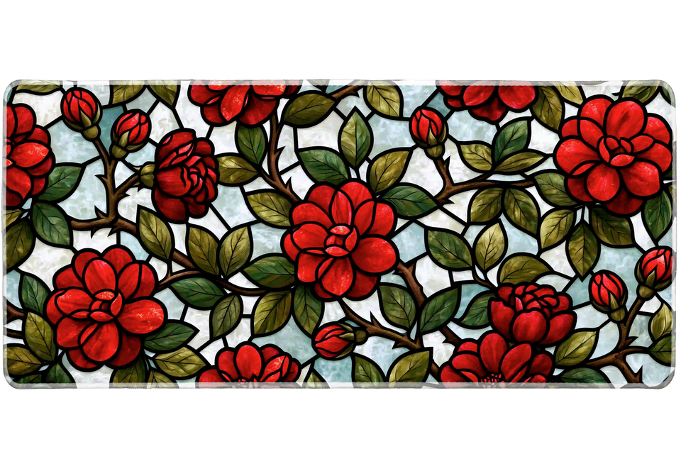 Red rose stained glass style desk mat with green leaves, brown vines and black outlines over pale blue and white