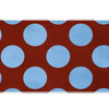 Wide Retro Polka Dot desk mat with powder-blue circles across a warm rust-red field