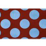 Wide Retro Polka Dot desk mat with powder-blue circles across a warm rust-red field