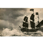 Stormy Pirate Ship desk mat product view highlighting a black sailing ship battling rain and crashing ocean waves
