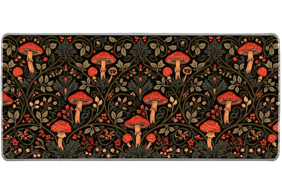 Vintage mushroom desk mat with red toadstools, orange stems, olive foliage and curling vines on black